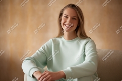 Young woman smiling wearing mint green sweatshirt Product Image 1