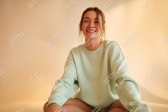 Young woman smiling wearing pastel sweatshirt happy Product Image 1