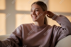 Young woman smiling wearing a mauve sweatshirt casual Product Image 1