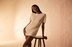 Woman in white dress on stool fashion Product Image 1