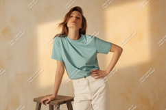 Woman wearing teal t shirt and white pants t-shirt Product Image 1