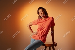 Woman wearing coral t shirt and blue jeans Product Image 1