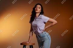 Woman wearing lavender t shirt and denim jeans image Product Image 1