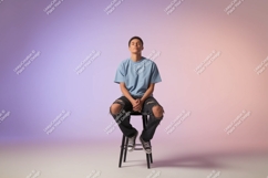 Young man sitting on stool blue shirt Product Image 1