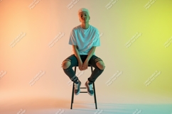 Person sitting on stool jeans ripped Product Image 1