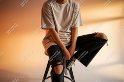Person wearing light shirt ripped jeans black Product Image 1