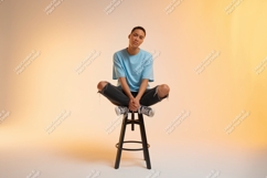 Person sitting cross legged on stool image Product Image 1