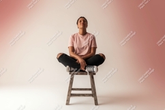 Woman sitting cross legged on stool image Product Image 1