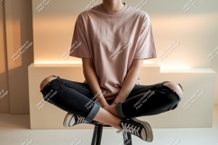 Person wearing pink t shirt and ripped jeans image Product Image 1