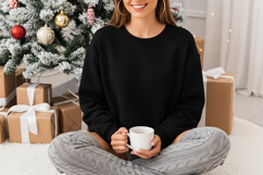 Cozy black sweatshirt mockup with holiday theme Product Image 1