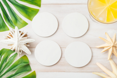 Four Blank Round Coasters Mockup with Cup and Flowers Product Image 1