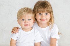 Photorealistic Kids T-Shirt Mockup with Two Children Product Image 1