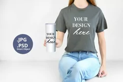 Gray t-shirt & white tumbler Mockup PSD, Woman holding Mock Product Image 1