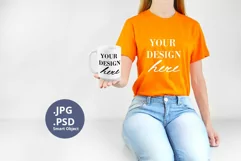 Orange t-shirt 15oz Mug Mockup PSD, Woman holding JPG Product Image 1