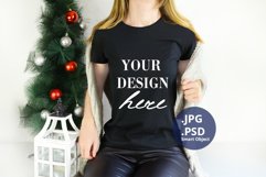 Black Christmas T-shirt Mockup On Young Woman, PSD Mockup Product Image 1