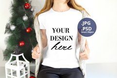 White Christmas T-shirt Mockup On Young Woman, PSD Mockup Product Image 1