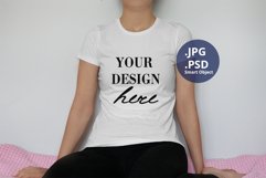 White T-shirt Mockup on Woman, Plain Background PSD Mockup Product Image 1