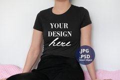Black T-shirt Mockup on Woman, Plain Background PSD Mockup Product Image 1