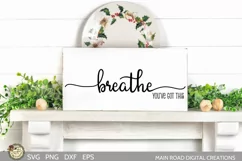 just breathe motivational quote svg file shown on a canvas sign