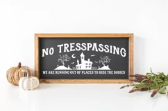 Welcome Halloween visitors with a touch of dark humor with this Funny Halloween Front Door Sign! The witty message "No Trespassing. We Are Running Out Of Places To Hide The Bodies"