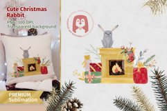 Cute bunny sitting on the fireplace with gifts and decor Product Image 1