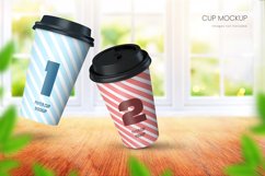 Realistic paper coffee cup mockup of two cups in bright room with big window