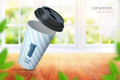 Paper cup mockup on in room with big window in the background