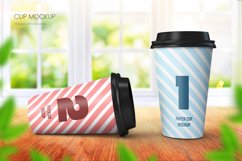 	 Paper coffee cup mockup of two cups on wooden tabletop with bright window background