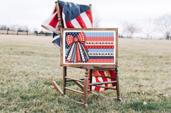 Patriotic digital PNG showing an oversized red and white checkered bow attached to a decorative American flag made of floral, striped, and star-patterned fabric sections.