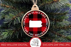 Round buffalo plaid Christmas Ornament design for Pennsylvania with the phrase &quot;there's no place like home for the holidays&quot; displayed on a wood ornament hung from a Christmas tree. 