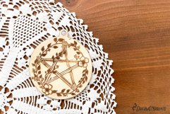 Witch ornament for laser cutting machines. It features a hand drawn pentacle with flowers.