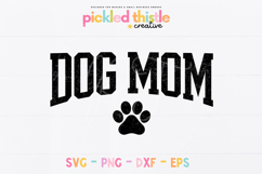 Simple and bold dog mom SVG design with a paw print detail. The black graphic has a vintage distressed look and is sized for use on shirts, tote bags, and pet-themed gifts.