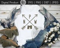pnw arrows with oregon silhouette shown on white tshirt as project idea with blue flannel shirt and boots