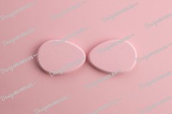 Cosmetic sponge in the shape of an egg on a pink background Product Image 1