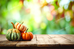 Autumn Fall Pumpkins on Wooden Table with Leaves Product Image 1