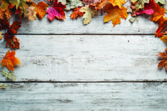 Autumn leaves on wooden background Product Image 1