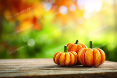 Autumn Fall Pumpkins on Wooden Table with Leaves Product Image 1