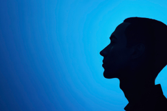 Boy Silhouette with Blue Background Product Image 1