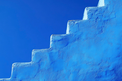 Blue Stairs with Blue Background Wallpaper Product Image 1