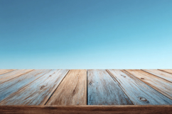 Empty Wooden Tabletop with a Blue Sky Background Wallpaper Product Image 1