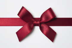 Red Ribbon Tied into a Bow with White Background Wallpaper Product Image 1