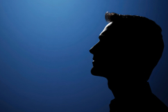 Silhouette Man with Blue Background Wallpaper Product Image 1