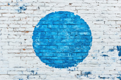 Blue Circle on a Brick Wall Background Wallpaper Product Image 1
