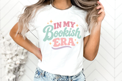 Cute bookworm shirt graphic in SVG, PNG, DXF, and EPS formats with pastel lettering and star details, ideal for reader apparel and handmade gifts.