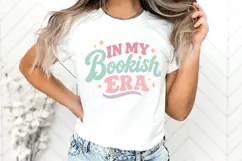 Cute bookworm shirt graphic in SVG, PNG, DXF, and EPS formats with pastel lettering and star details, ideal for reader apparel and handmade gifts.