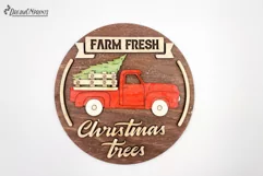 Red Christmas truck round sign with the saying "Farm fresh Christmas trees".