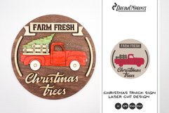 Red Christmas truck round sign with the saying "Farm fresh Christmas trees".