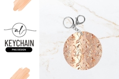 Elegant round keychain with ornate floral design Product Image 1