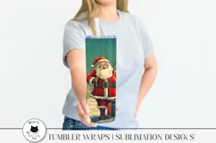 woman holding a tumbler with santa design