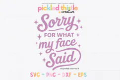 White mug featuring pink typography that reads “Sorry For What My Face Said” with sparkles and playful script lettering.